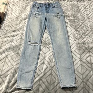 Light blue ripped skinny jeans from American Eagle in a size 0